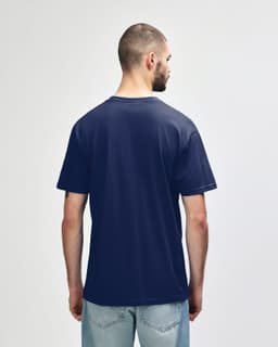 A navy blue Gildan Softstyle adult midweight T-shirt displayed from the back, featuring a simple design and a logo.