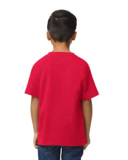 A red Gildan Softstyle youth midweight t-shirt displayed on a child standing sideways, with hands behind their back.