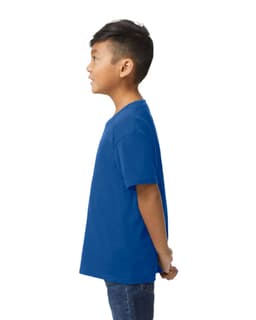 A blue Gildan Softstyle youth midweight t-shirt viewed from the back, worn by a child. The shirt has a logo.