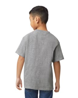 A youth midweight T-shirt in grey, featuring short sleeves and a relaxed fit. The model stands with hands in pockets.