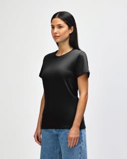 A black midweight t-shirt for ladies, featuring a classic fit and short sleeves. The model is wearing it with jeans.