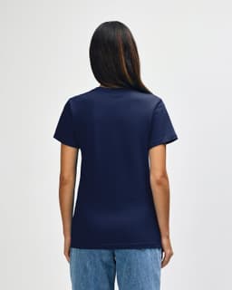 A navy blue ladies' midweight t-shirt featuring a branding logo on the back, worn by a model.
