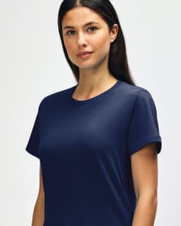 A close-up of a navy blue Gildan Softstyle ladies midweight T-shirt featuring a round neckline and short sleeves.