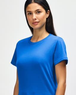 A midweight ladies' t-shirt in bright blue, featuring a round neckline and short sleeves, with a logo present.