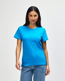 A midweight T-shirt in bright turquoise, featuring short sleeves and a crew neck, modelled by a woman.
