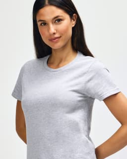 A grey Gildan Softstyle ladies midweight T-shirt on a model, featuring a round neckline and short sleeves.