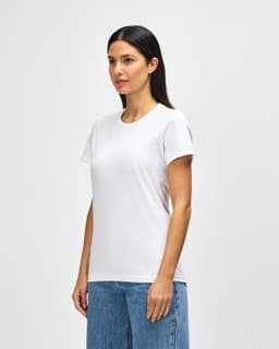 A white midweight ladies t-shirt displayed on a model, featuring short sleeves and a casual fit.