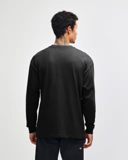 A black American Apparel Super Heavyweight T-shirt displayed from the back, featuring a simple design.