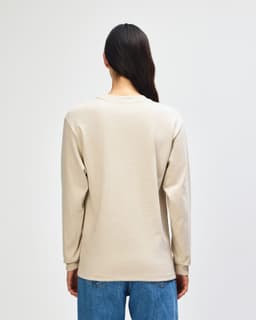 A beige American Apparel Super Heavyweight T-Shirt displayed from the back, featuring long sleeves and a simple design.