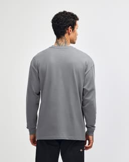 A grey long sleeve t-shirt with a simple design and a logo on the back.