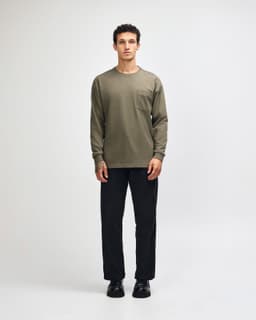 An olive green heavyweight long-sleeve t-shirt with a chest pocket, paired with matching olive green trousers.