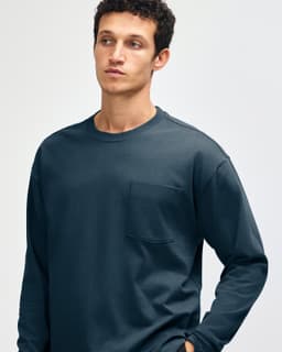A long-sleeve super heavyweight t-shirt in dark teal, featuring a single chest pocket and a crew neckline.