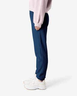 Unisex sweatpants in navy blue, featuring a slim fit and elastic cuffs, with a logo on the waistband.