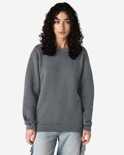 A unisex crewneck sweatshirt in grey, featuring a relaxed fit and long sleeves. It has a subtle logo branding.