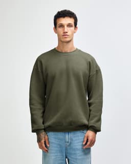 A unisex crewneck sweatshirt in olive green with long sleeves and a relaxed fit, featuring a logo.