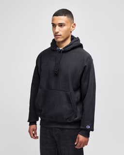 A black hooded sweatshirt with a front pocket, featuring a logo on the sleeve.