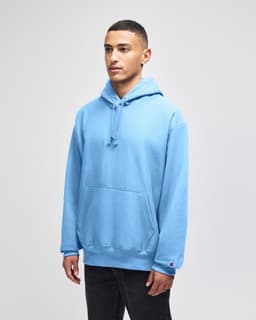 A light blue hoodie with a front pocket and a drawstring hood, featuring a logo.