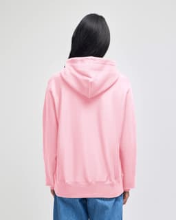 A pink pullover hooded sweatshirt with a hood, viewed from the back, featuring a logo.