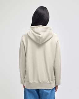 A light grey pullover hooded sweatshirt viewed from the back, featuring a hood and loose fit.