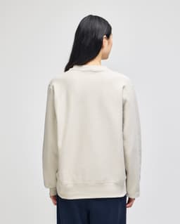 A grey Champion Reverse Weave® adult crew sweatshirt, viewed from the back, featuring a simple design and a branding logo.