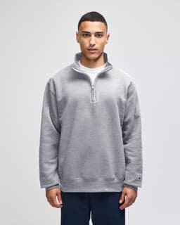 A grey Champion Powerblend® adult quarter-zip pullover, featuring a front zip and a logo. Casual and comfortable design.