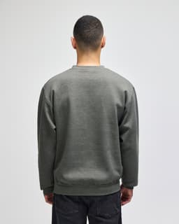 A grey adult crewneck sweatshirt is displayed from the back, featuring long sleeves and a simple design.