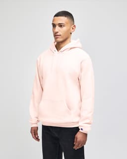 A beige pullover hooded sweatshirt with a front pocket and a logo on the sleeve.