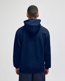 A back view of a navy pullover hooded sweatshirt. The sweatshirt has a hood and a relaxed fit.