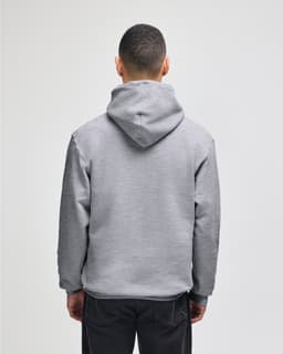 A grey pullover hooded sweatshirt viewed from the back, featuring a spacious hood and relaxed fit.