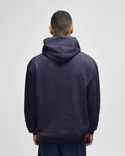 A back view of a navy blue pullover hooded sweatshirt with a hood and a logo.