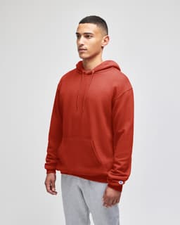 A hooded sweatshirt in a rich rust colour, featuring a front pocket and a logo on the sleeve.