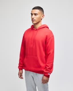 A red pullover hooded sweatshirt with a front pocket and a logo, worn by a model against a plain background.