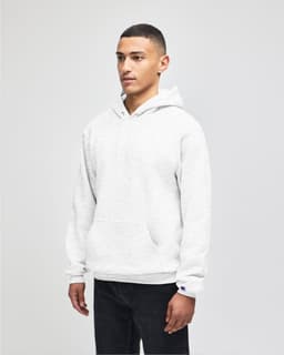 A grey pullover hooded sweatshirt with a front pocket and branding on the sleeve, modelled by a person.