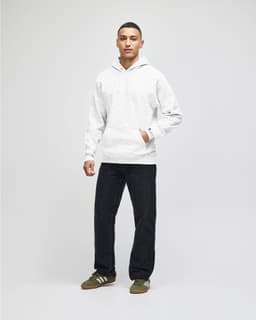 A light grey hooded sweatshirt paired with navy shorts, featuring a front pocket and a logo.