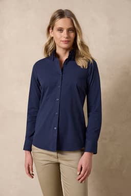 A navy blue ladies long sleeve button-up shirt with a fitted design. The model stands against a neutral background.