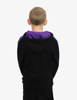 A child's hoodie in black with a purple hood and detailing, viewed from the back. Features a logo.