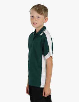 A green polo shirt with white accents, displayed on a young model. The shirt features a collar and short sleeves.