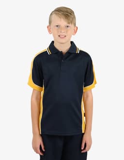 A boy is wearing a navy blue polo shirt with yellow accents and a logo on the chest.