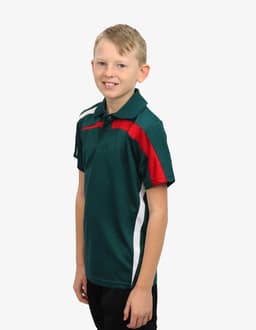 A child wearing a green polo shirt with red and white accents, featuring a logo on the chest.