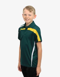A green polo shirt featuring yellow and white detailing, modelled by a young boy. The shirt has a logo.