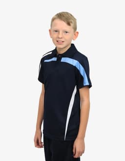 A boy wearing a navy blue polo shirt with light blue and white accents, featuring a logo.