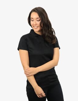A black polo shirt with a collar, designed for a fitted look, featured on a model smiling.