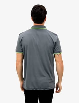 A grey polo shirt with a contrasting green collar, featuring a logo on the back.