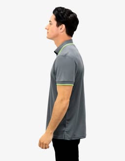 A grey polo shirt with green accents, featuring a collar and short sleeves. The shirt has a logo.