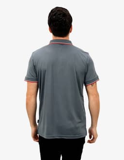 A grey polo shirt with contrasting red trim, featuring a logo on the back, modelled by a person.