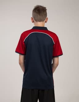A polo shirt featuring a navy blue base with red accents and a logo on the back.