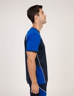 A side view of a man wearing a navy blue and blue T-shirt with contrasting white detailing and a logo.