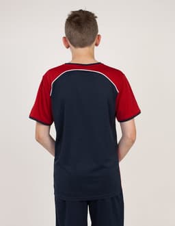 A boy wearing a red and navy blue T-shirt, viewed from the back, featuring a logo on the upper back.