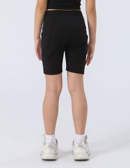 Black legging shorts for girls, featuring a fitted design and a logo on the waistband.