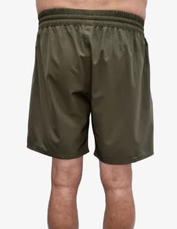 Olive green sports shorts with an elastic waistband, showing the back view. The shorts have a simple design and include a logo.
